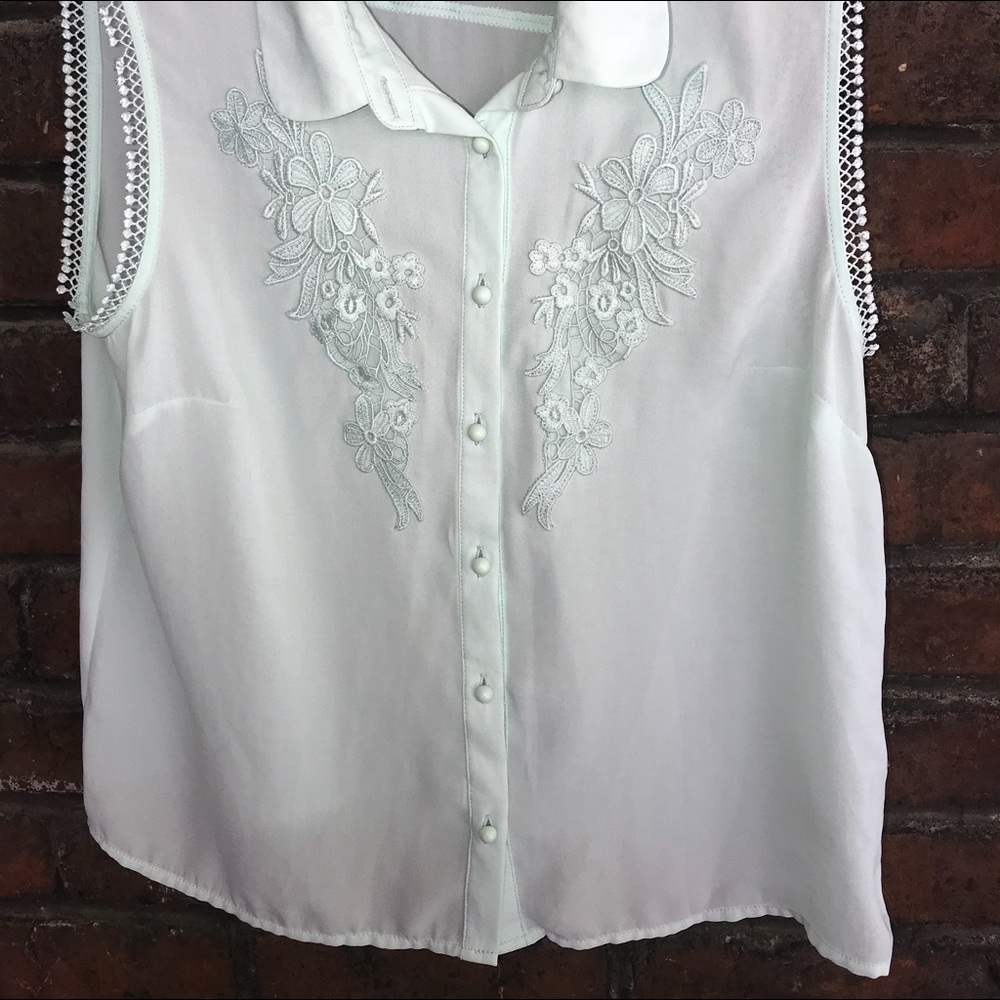 H&M’s mint green sleeveless blouse